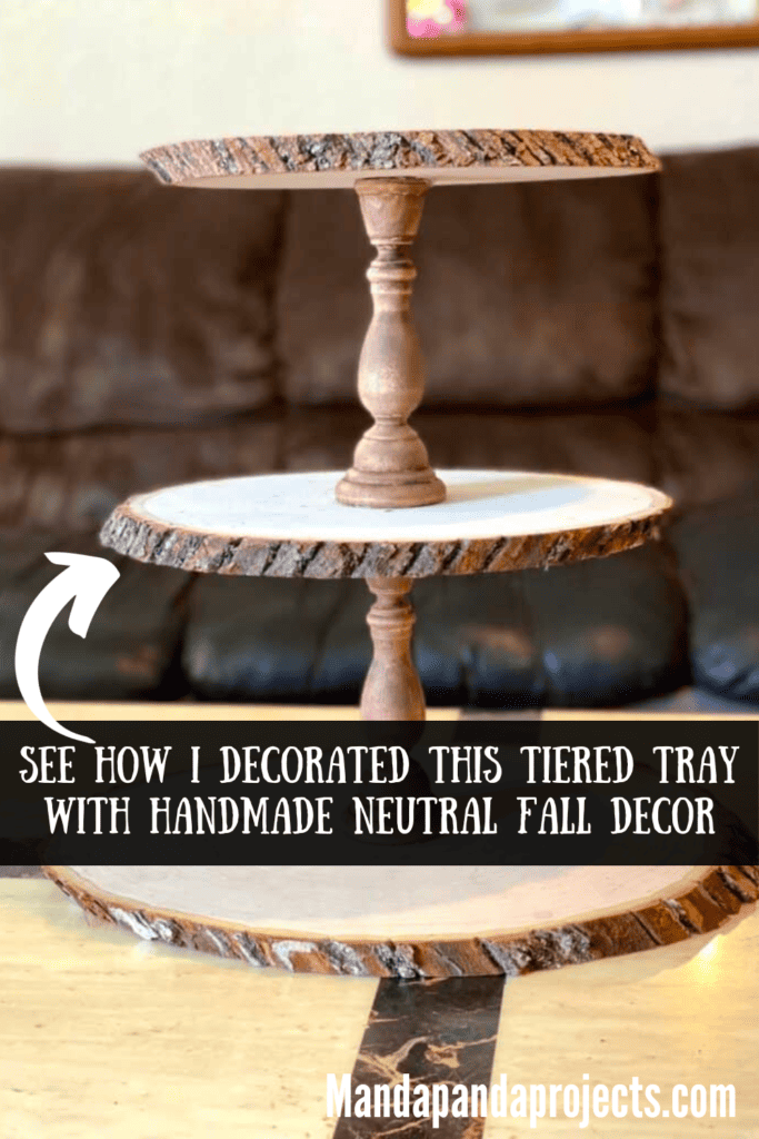 Diy handmade rustic wooden 3 tiered tray with candle sticks in between each tier.