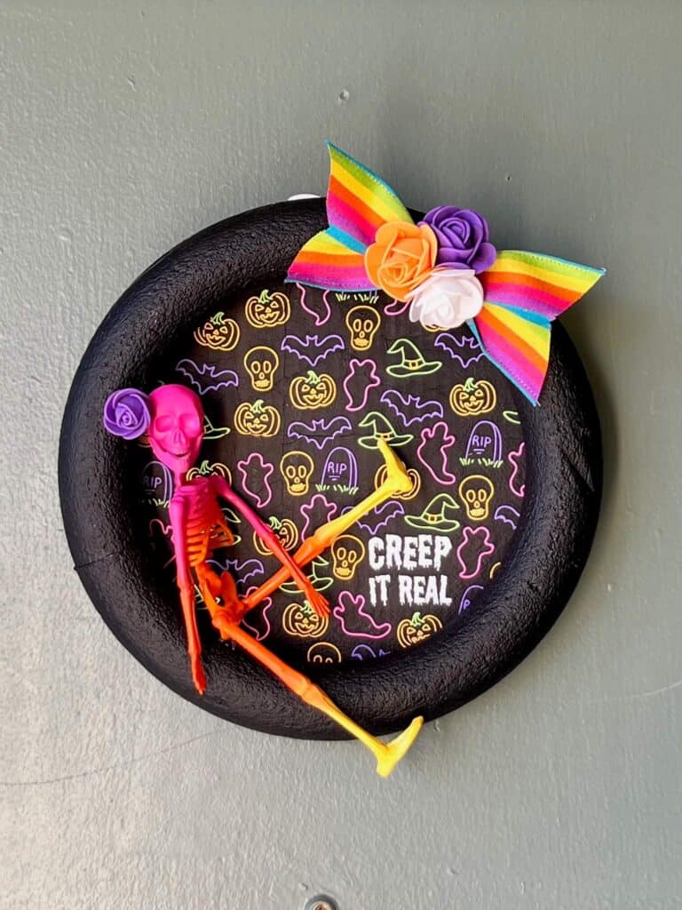 Creep it real colorful napkin skeleton wreath with a rainbow bow.