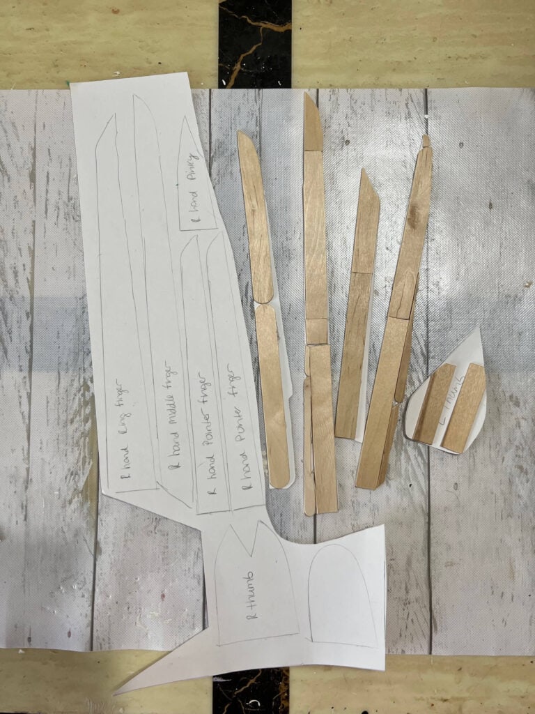 The edward scissorhands glovee template with cut popsicle sticks.