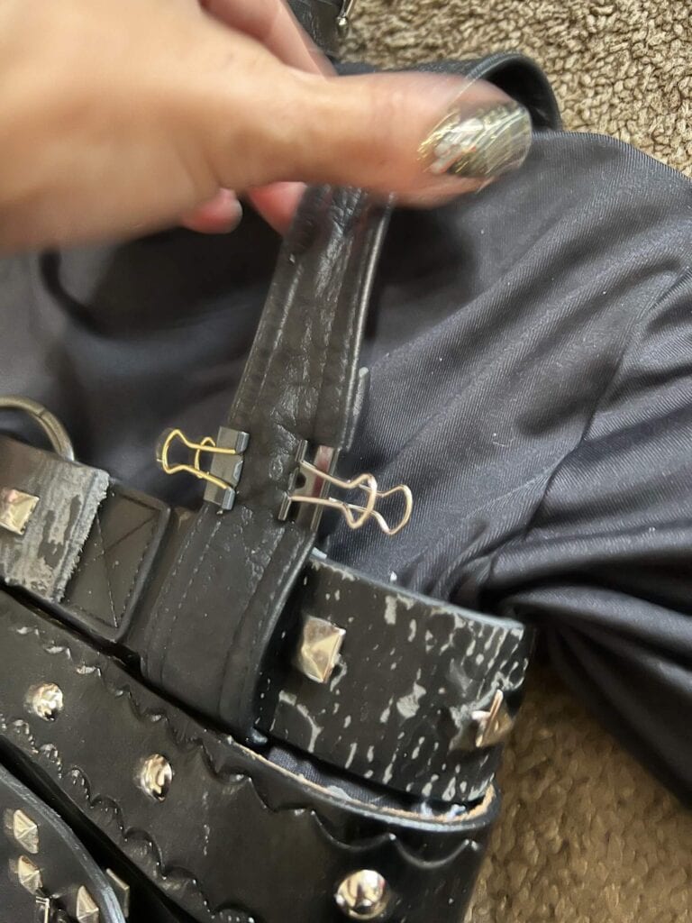Leather shoulder straps glued onto the shirt.