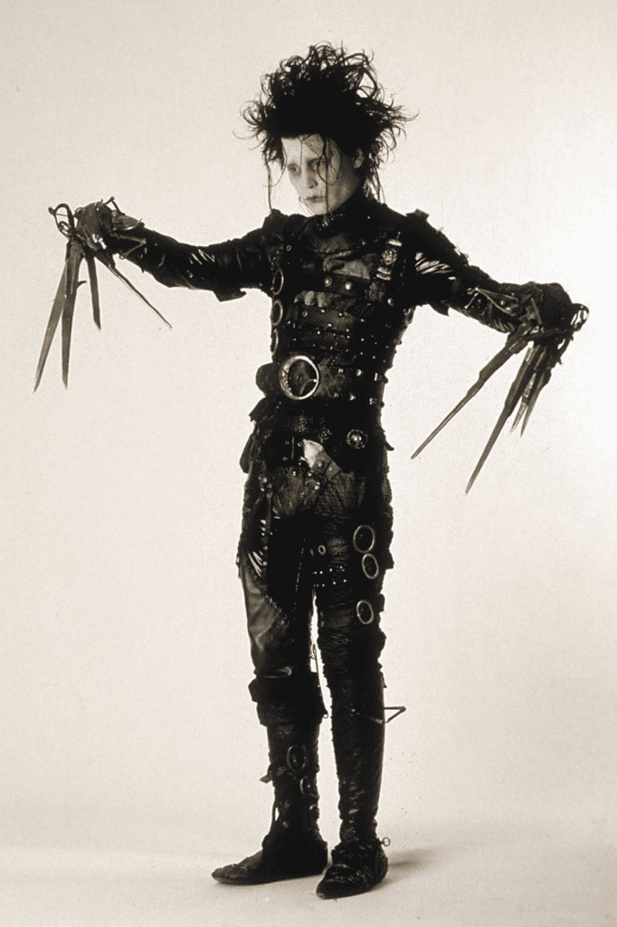 Edwards scissorhands picture from the movie of him in the black belted suit.