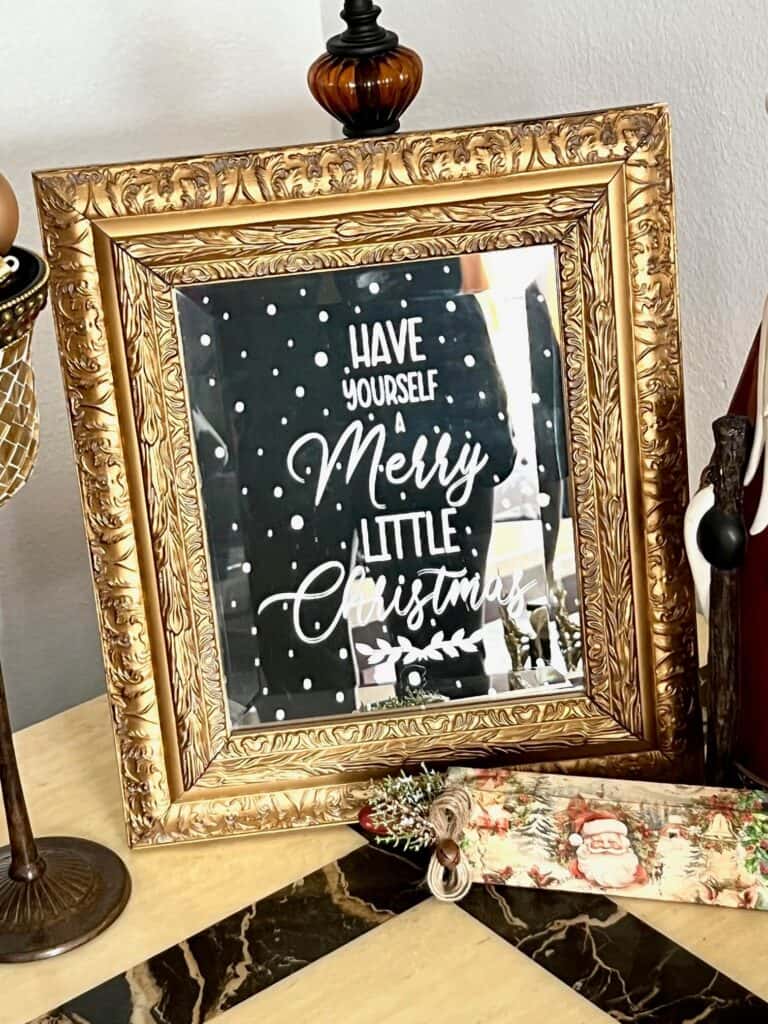 Upcycled gold thrift store mirror into an Etched Christmas Mirror with Armour Etch cream that says "Have yourself a Merry Little Christmas" made to look like a Hobby Lobby Copycat decor. Budget friendly DIY.