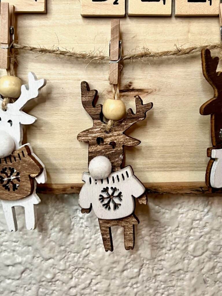 Close up of the mini reindeer hanging from a piece of twine with a mini clothespin