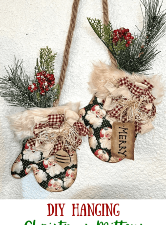 DIY Hanging Christmas Mittens with vintage santa scrapbook paper, greenery and berries, a "Merry" hangtag, and fur cuffs, DIY Christmas and winter crafts and decor.