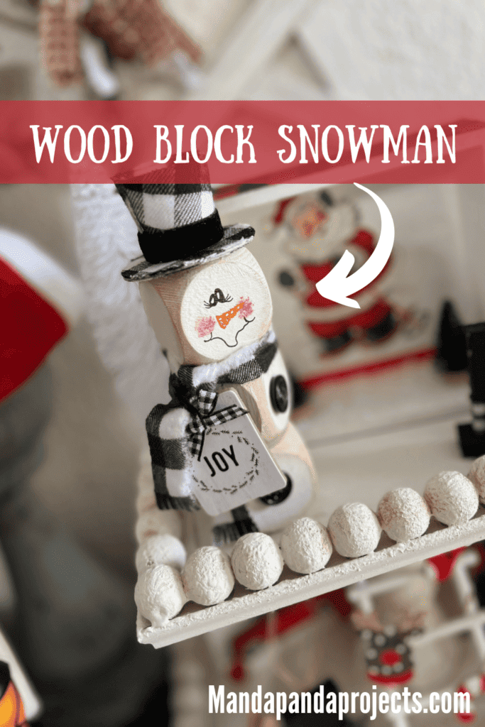 Dollar Tree Wood Block Snowman small 3 wood blocks stacked wonky with a buffalo check top hat, "Joy" hangtag, buffalo check scarf, hand painted face, perfect size for winter tiered tray decor.