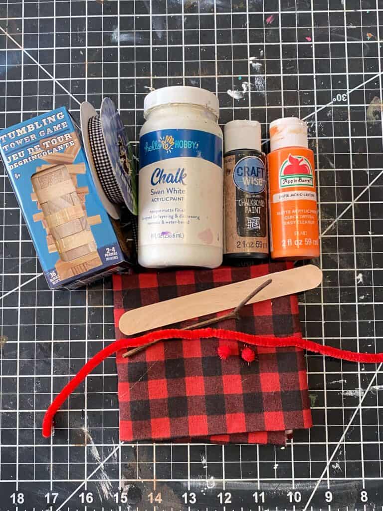 Supplies needed to make the project laid out on a craft mat.