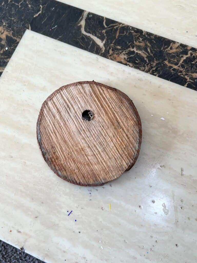 A natural wood round sitting on a table.
