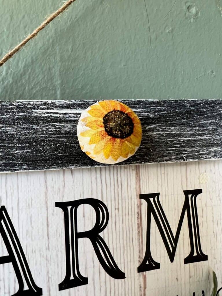 Large half wood beads decoupaged with sunflower napkin.