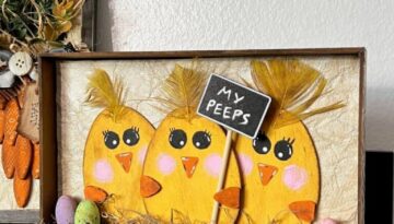 My Peeps Wood Egg Chicks Shelf Sitter made with Dollar Tree Wood Easter Eggs, a frame, some mini eggs, and a sign that says "My Peeps". 3 egg shaped yellow chicks with yellow feathers.