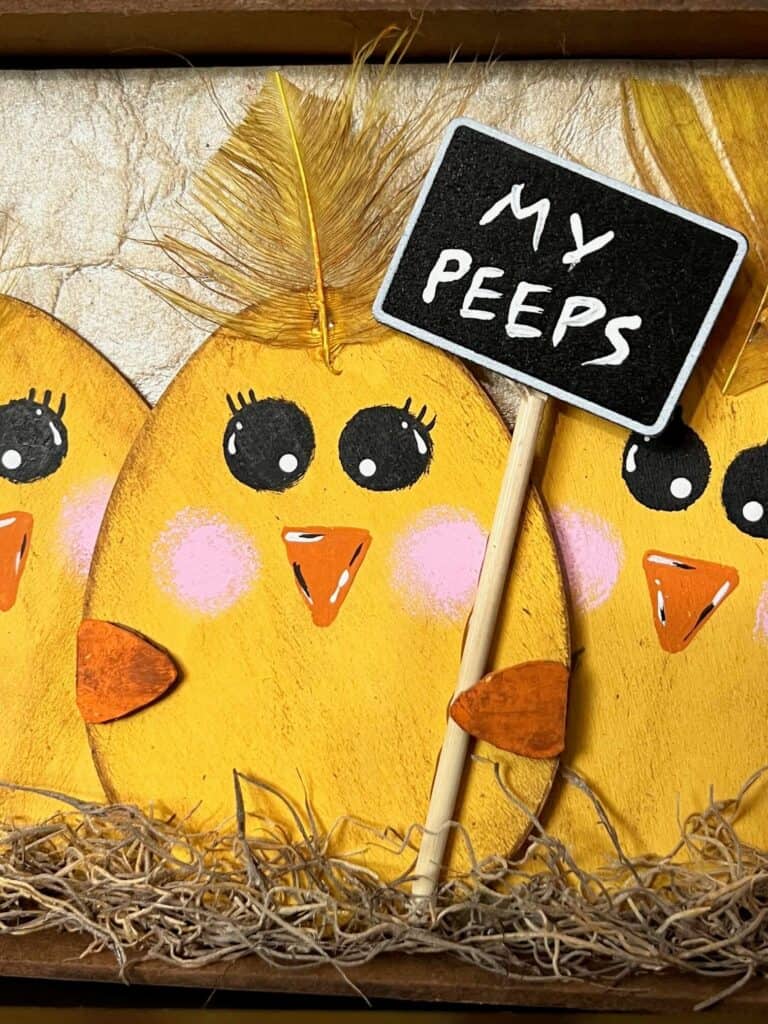The wood egg chick is holding a chalkboard sign that says "My Peeps".