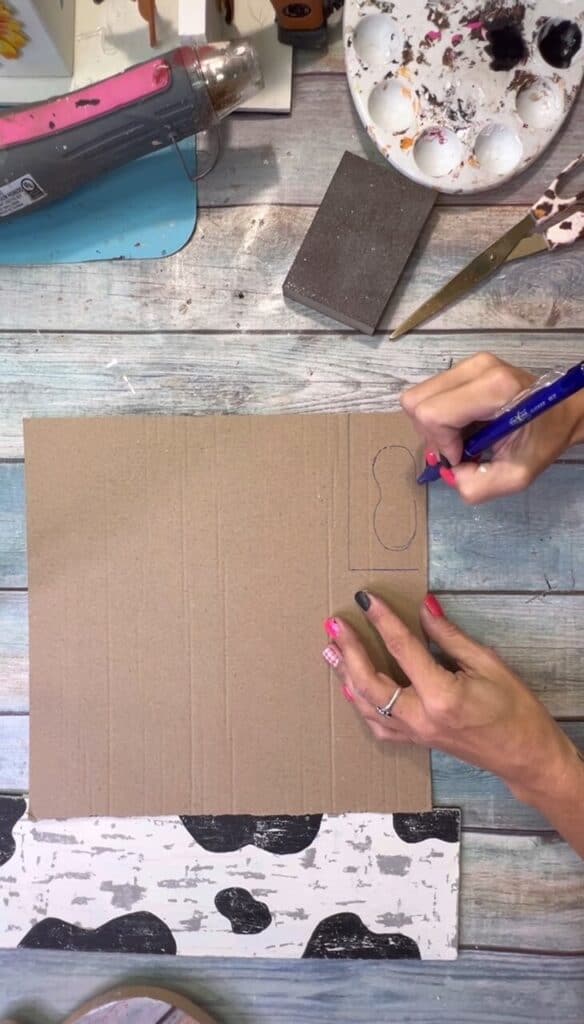 Draw the shape of the mouth (or is that called a snout!?) onto a piece of cardboard and cut that out