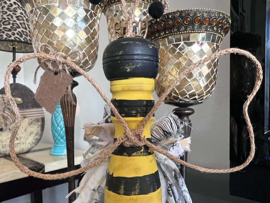 The wings made fro wired jute glued to the back of the pepper grinder bee body.