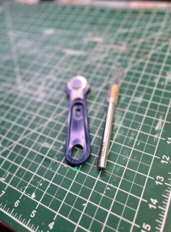 Leather crafting cutting tools, self-healing mat, rotary cutter, X-acto knife.