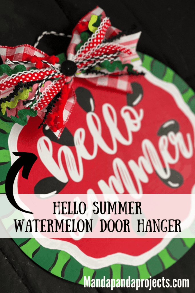 DIY Hello Summer Watermelon Door Hanger made with a wood round, a fabric bow, and white cricut vinyl to decorate your home front door.