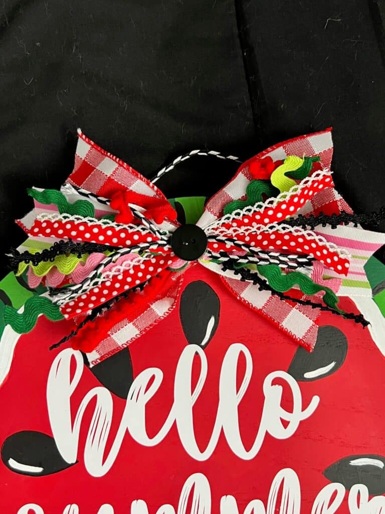 Messy fabric and ribbon coordinating bow.