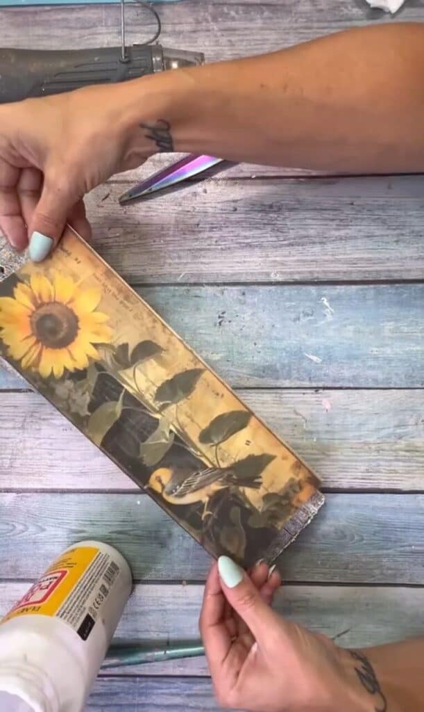 Mod Podge the free sunflower printable to the scrap wood.