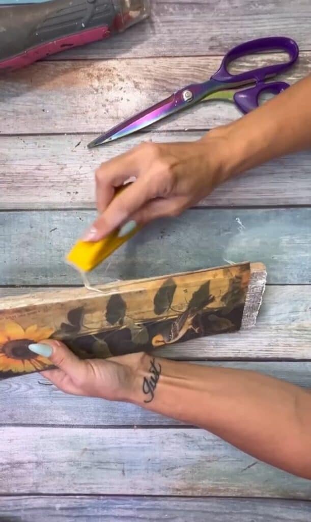 Sanding the excess rice paper off the edges with a Gator Sander.