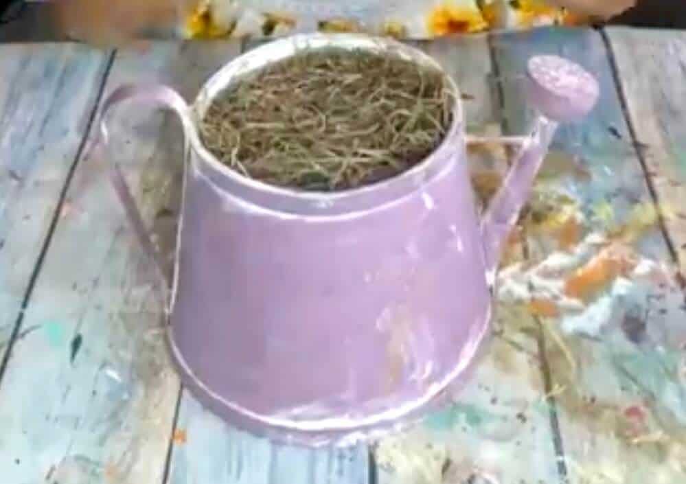 A purple thrifted watering can "before" picture.