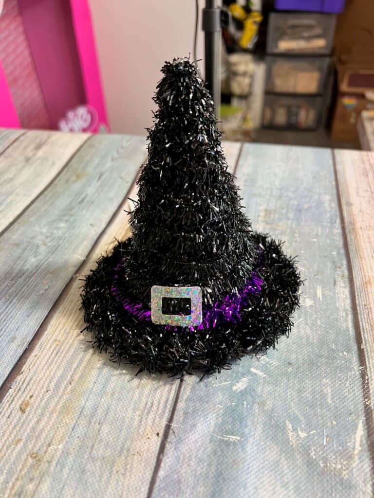 A dollar tree black tinsel witch hat.