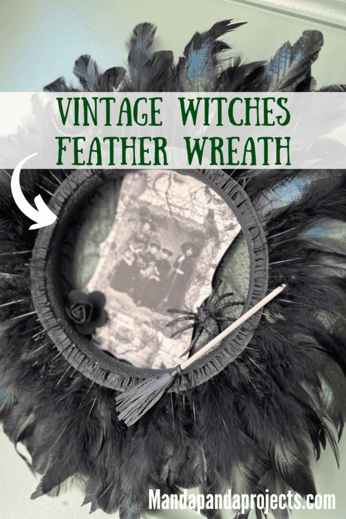 Dollar Tree styrofoam wreath form with black feather trim around the outside, vintage witches rice paper sign in the center, and embellished with faux spiders, mini broomstick, and a black rose for DIY Halloween crafts and decor.