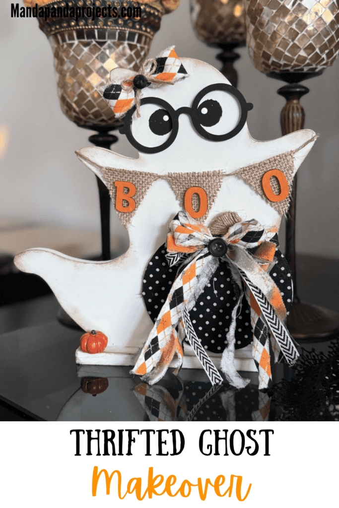 Cute thrifted wood standing ghost makeover with a black and white polka dot pumpkin, a burlap banner that says "BOO", black eyeglasses, and an orange and black fabric bow.