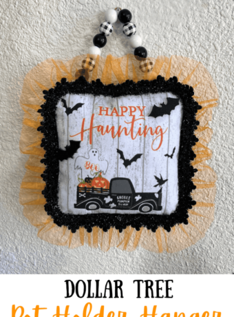 Dollar Tree Halloween Pot Holder with a Ghost, bats, and an old truck that says "Happy Haunting with orange tulle trim around the edge and a black and white buffalo check wood bead hanger, DIY doorknob hanger.