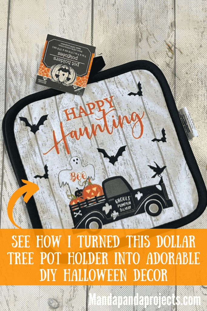 Dollar Tree Halloween Pot Holder with a Ghost, bats, and an old truck  with pumpkins in the back that says "Happy Haunting.