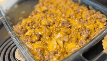 Cabbage casserole with sautéed cabbage, ground beef, onion and extra sharp cheddar cheese, layered and baked until cheese is melted and served with franks red hot sauce.