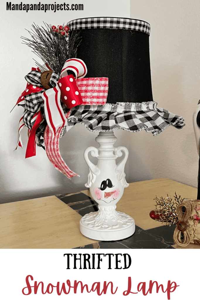 Turn and ordinary thrift store small lamp into adorable and budget friendly Christmas and Winter decor by painting it to look like a snowman. With the lampshade being the "top hat" with a cute red, black, and white bow and a jingle bell, and the lamp body painted like a snowman face. 