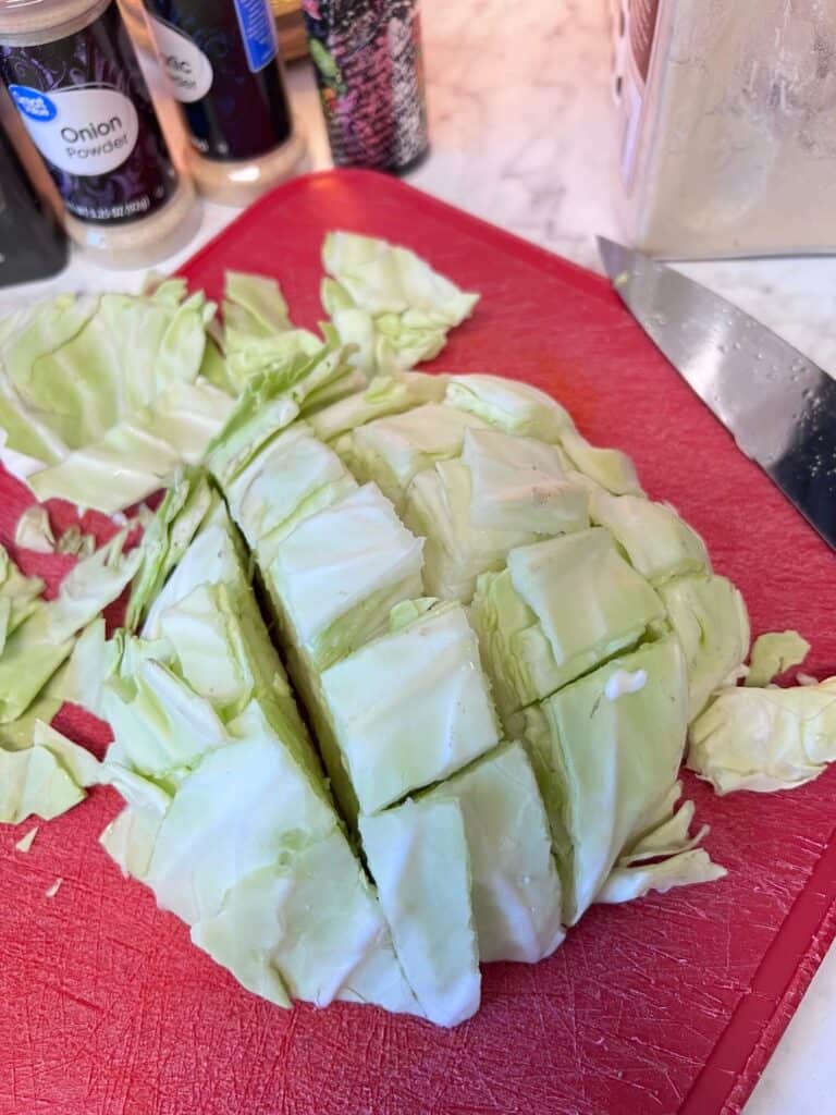 Cabbage chopped up on a cutting board.