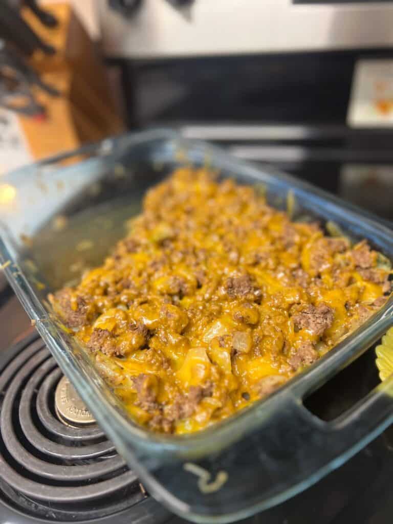 Cabbage casserole with sautéed cabbage, ground beef, onion and extra sharp cheddar cheese, layered and baked until cheese is melted and served with franks red hot sauce.