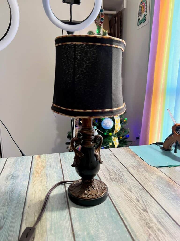 A black and brown small thrifted lamp.