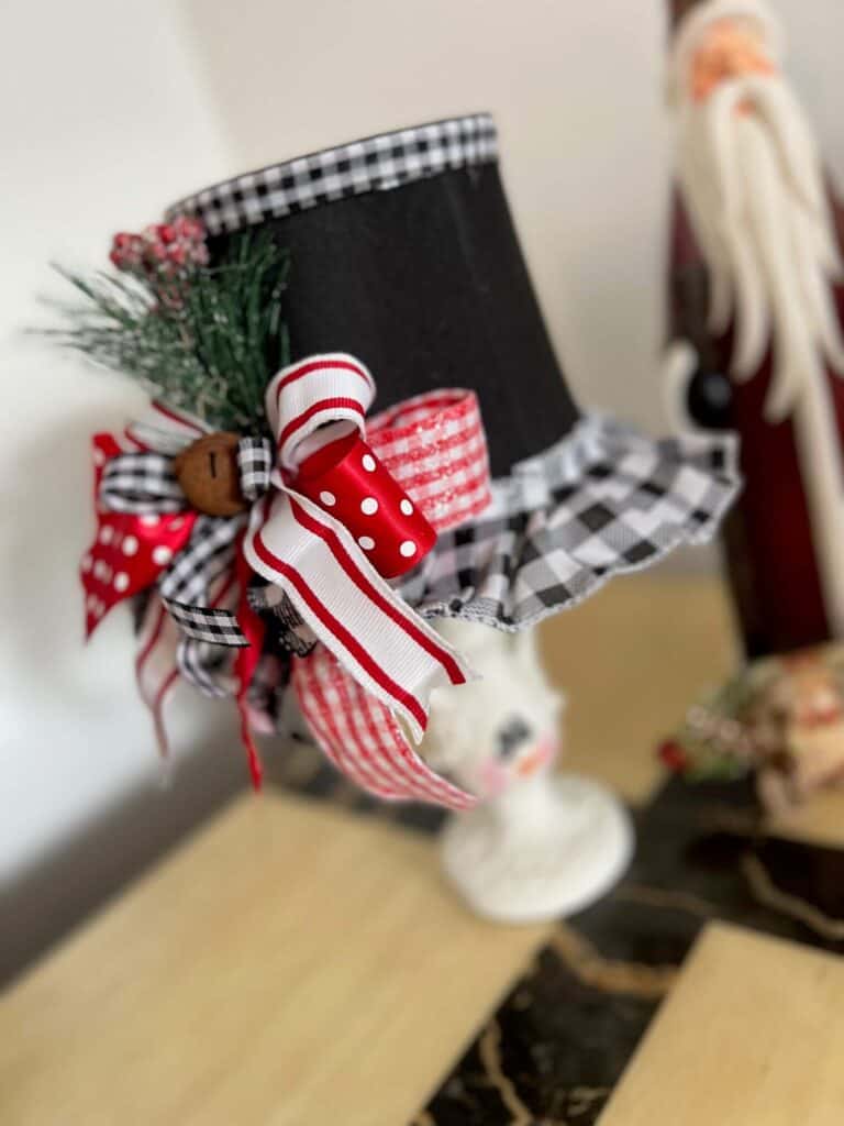 Huge black red and white bow on the thrifted lampshade.