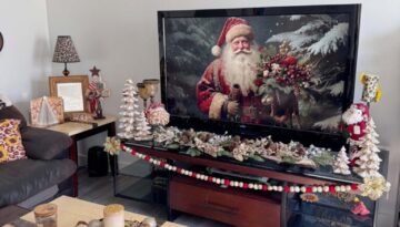 San Diego apartment living room decorated for Christmas in 2024 with vintage gold, white, and and maroon theme with santas, snowmen, christmas trees, Angels, and lots of gold!