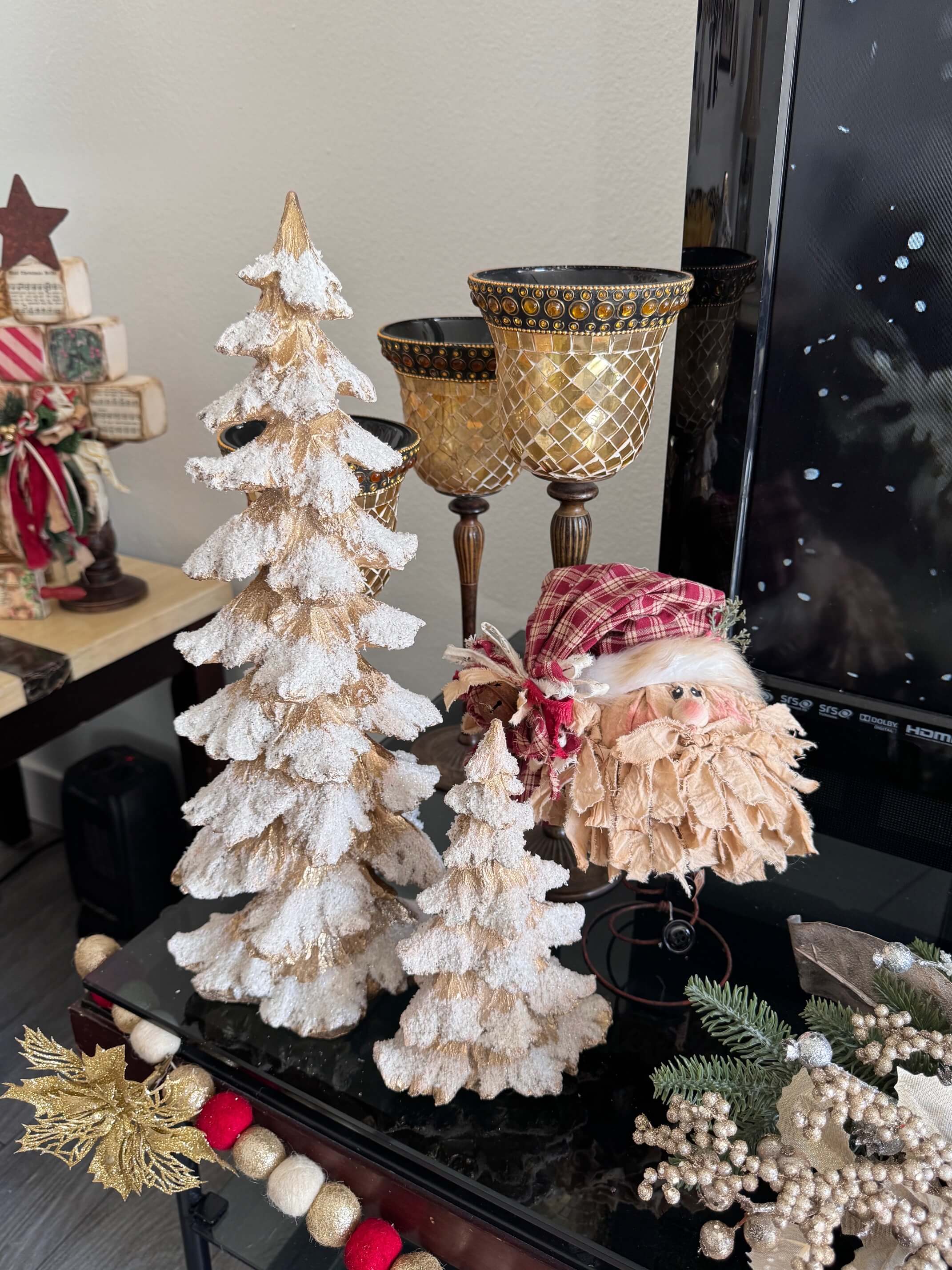 Gold resin christmas tree set and a bedspring santa.