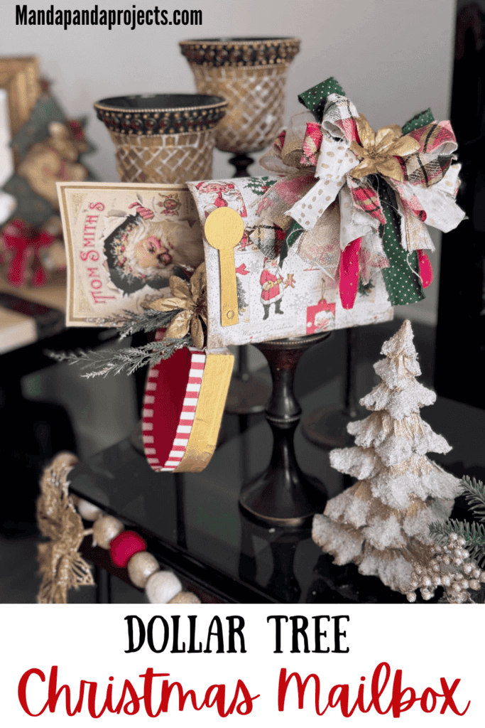 A dollar tree penguin cardboard mailbox that was made over for Christmas with a vintage santa napkin, some gold poinsettias, christmas greenery, and a messy fabric bow on a wood candlestick base for DIY decor. 