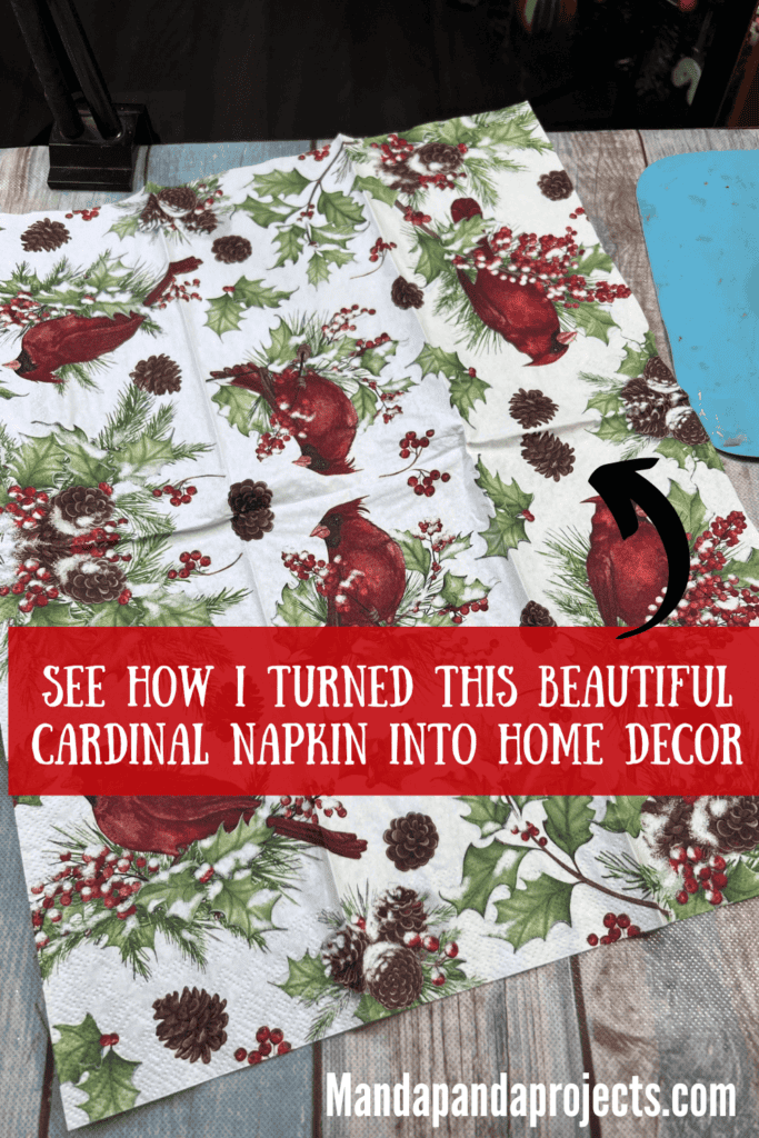 Red Cardinal Napkin opened up on a table.