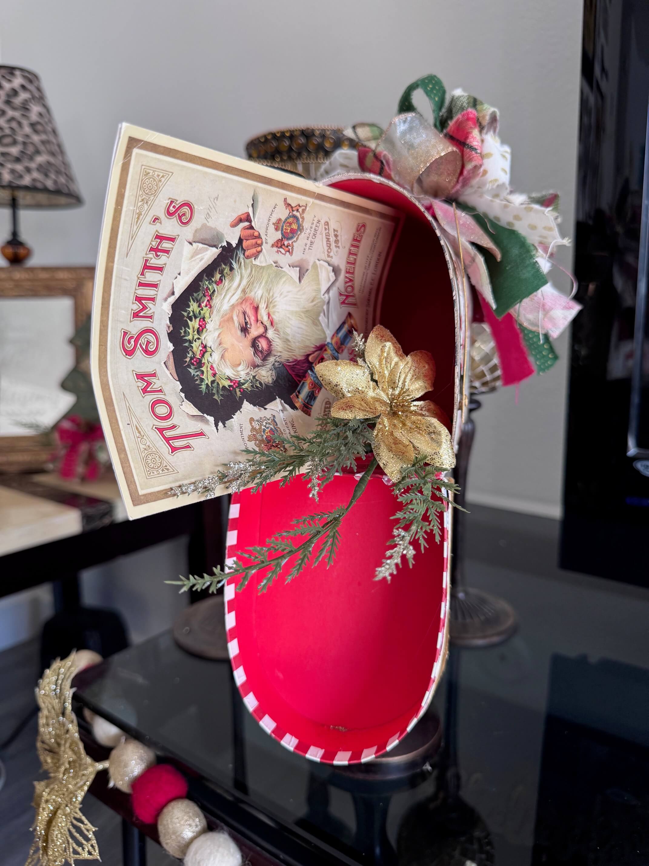 The inside with a vintage Santa christmas card and greenery and poinsettia.