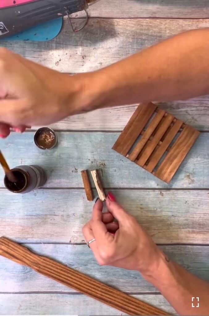 Staining the jenga blocks with antique wax.