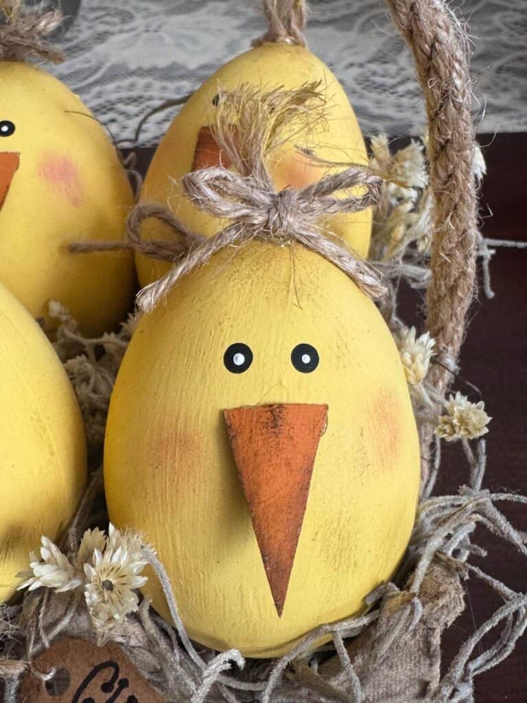 Close up of one of the wooden easter egg chicks.