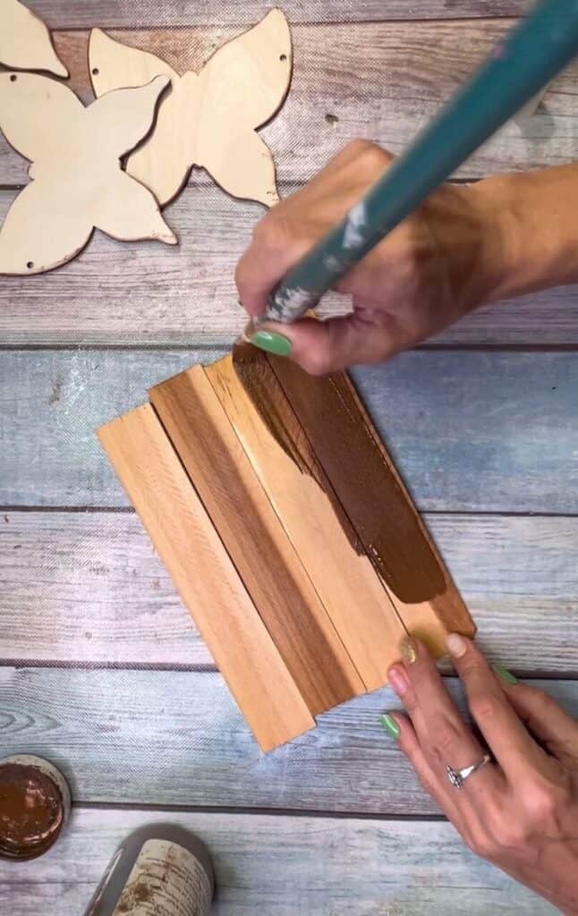 Stain the 4 wood shims with Antique wax.