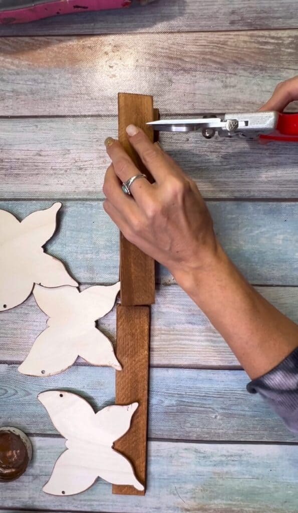 Cut the wood shims to size so that the 3 butterflies fit on perfectly.