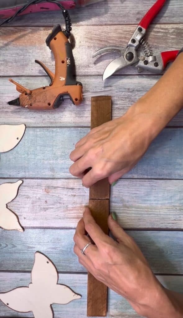 Glue the two sets of shims to each other to make one long base.