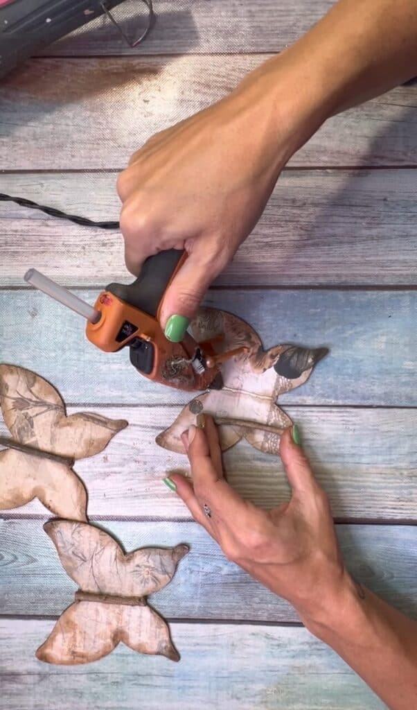 Glue the stick to the center of the butterfly body.