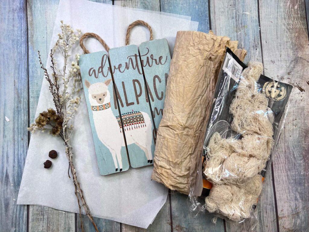 All of the supplies needed to make the craft laid out on the table.