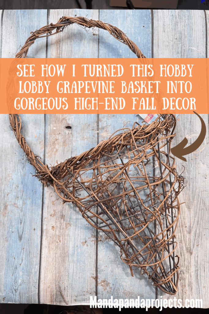 Fall floral grapevine wreath basket door decor hanging on a sage green front door with pretty fall flowers, a sweater pumpkin pick and a hangtag that says "Fall vibes".