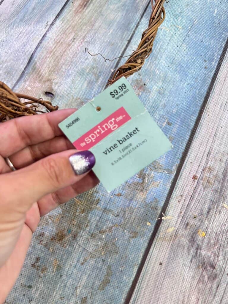 The tag of the grapevine basket that says "$9.99 vine backet".