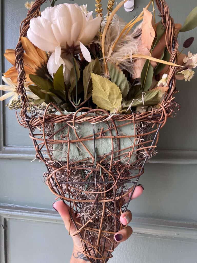 The back of the grapevine basket with the spanish moss and floral foam showing.