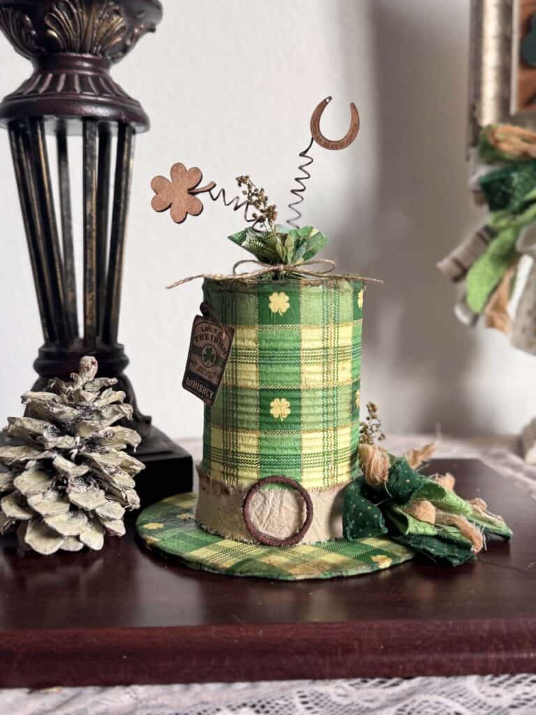 Tin Can decoupaged leprechaun hat with a St. Patricks Day check and shamrock napkin with green bow and cute tag.