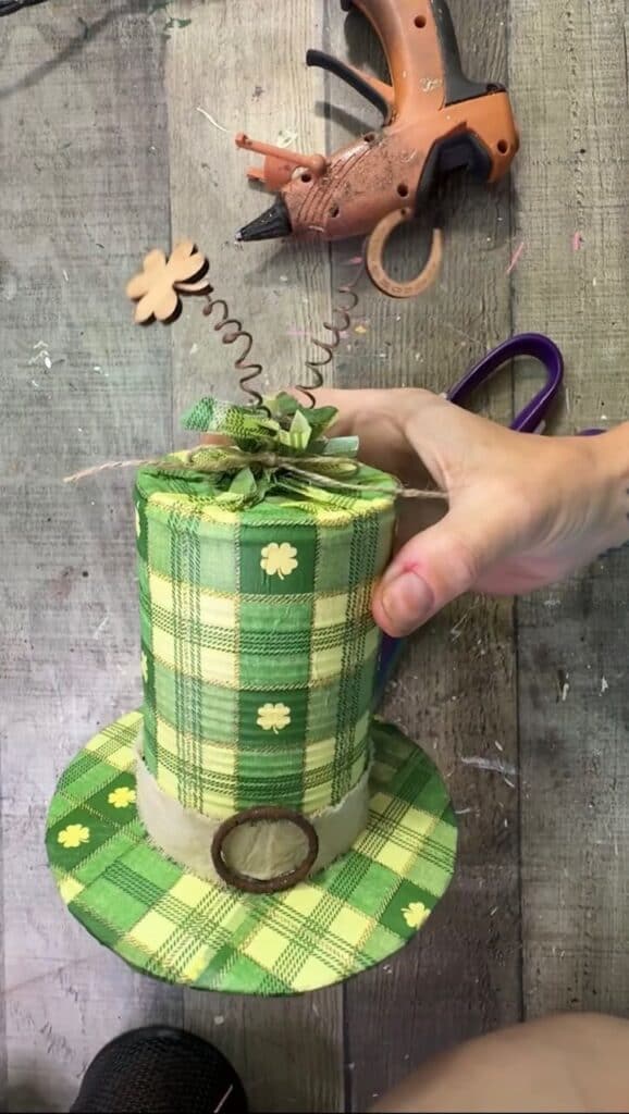 A wood shamrock and horseshoe springing out of the top of the leprechaun hat.